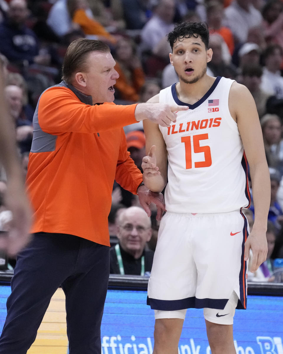 Illinois head coach Brad Underwood talks with RJ Melendez during the second half of an NCAA college basketball game against Penn State at the Big Ten men's tournament, Thursday, March 9, 2023, in Chicago. Penn State won 79-76. (AP Photo/Charles Rex Arbogast)