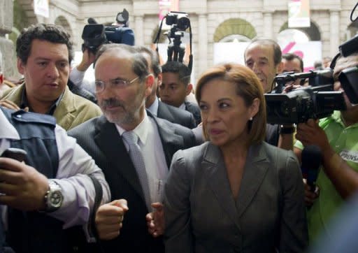 Mexican presidential candidate for the National Action Party (PAN), Josefina Vazquez Mota (R), leaves at the end of the First Citizen Summit organized by Civil Society in Mexico City on May 22. Online social networks, a newcomer in Mexican elections, are making a mark on the country's presidential campaign, forcing candidates to respond to issues and protests enabled by the Internet