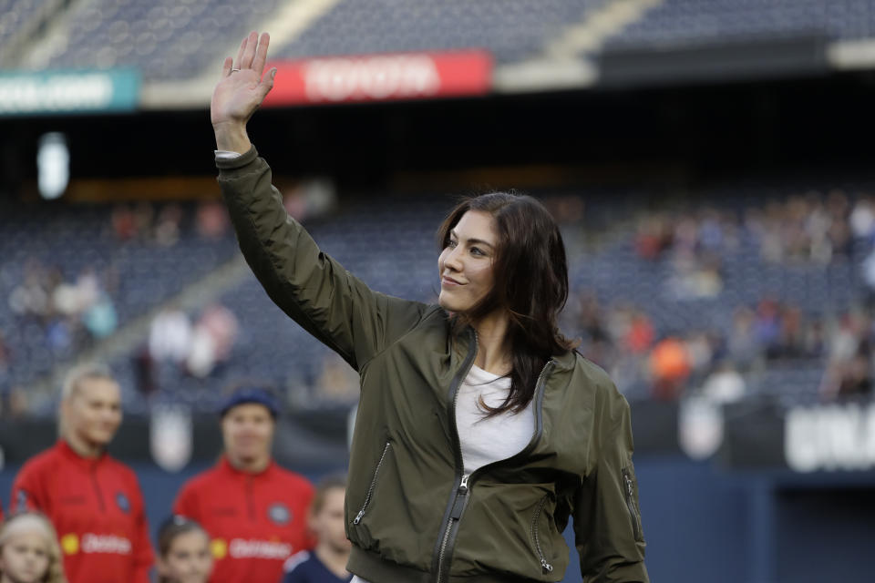 Former United States goalkeeper Hope Solo reacts during ceremony before an international friendly soccer match against Denmark Sunday, Jan. 21, 2018, in San Diego. Solo appeared in 202 games for the national team, most for any goalkeeper in U.S. history. (AP Photo/Gregory Bull)