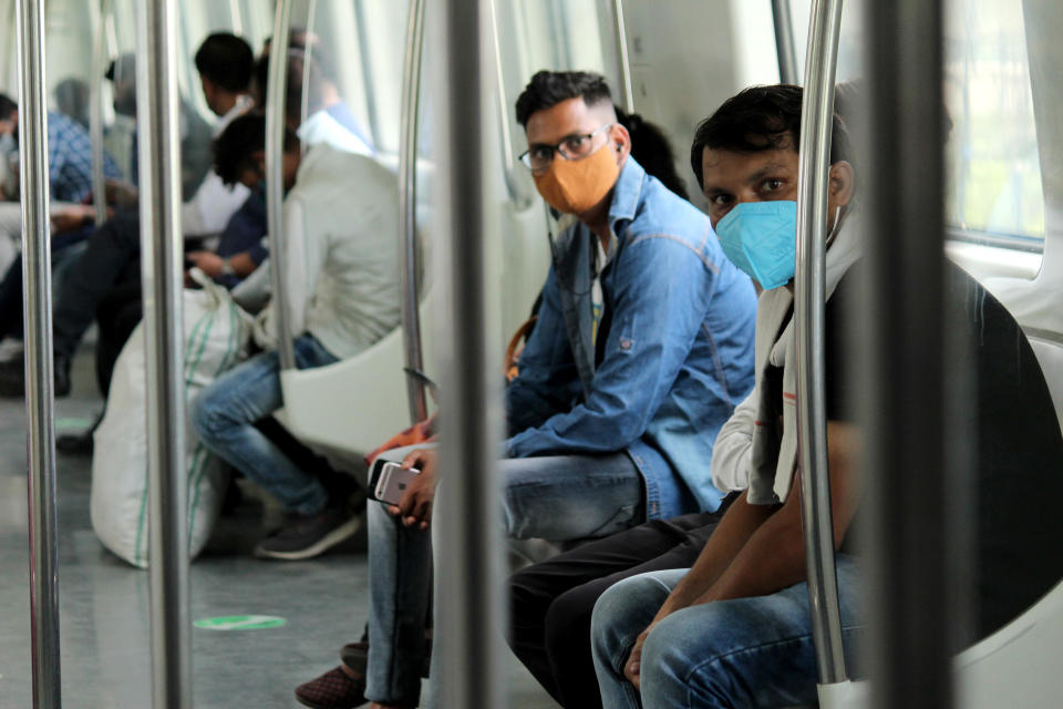 Commuters travel in a Delhi Metro train after service was permitted to resume at 50% capacity with an easing of anti-COVID-19 restrictions, in New Delhi, India, June 7, 2021. / Credit: Mayank Makhija/NurPhoto/Getty