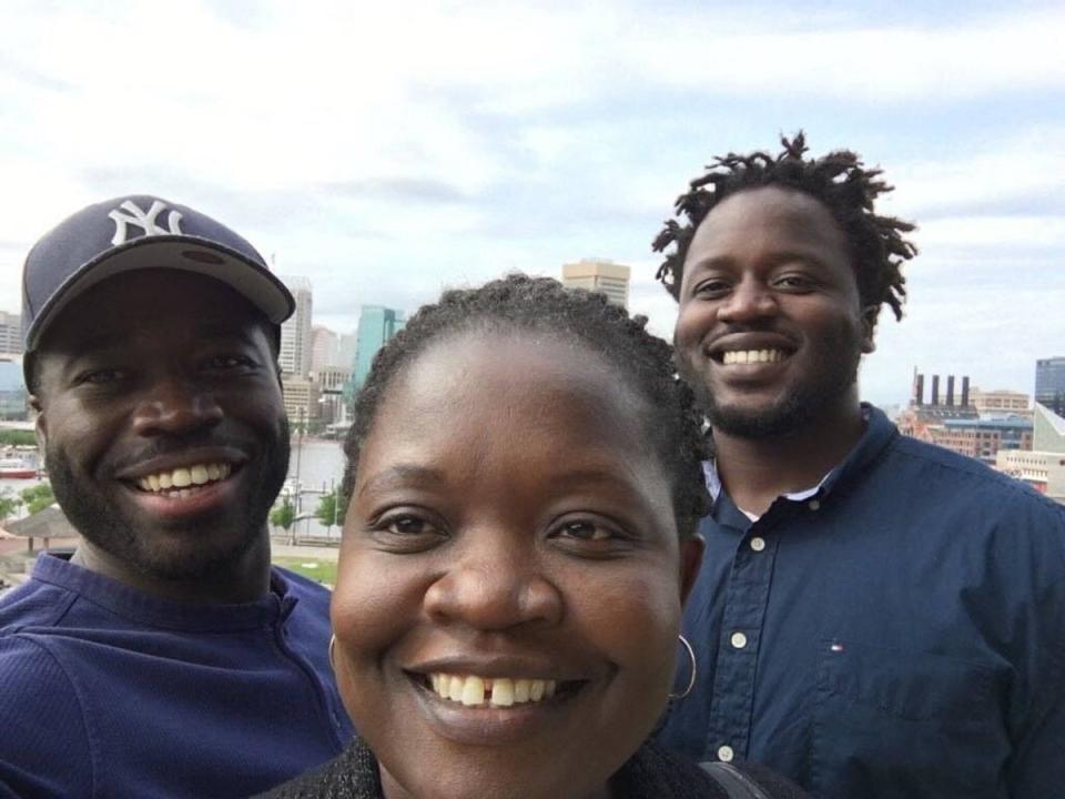 This undated handout photo provided by Ben Crump Law shows Irvo Otieno (R), 28, who died on March 6, 2023, with his mother and brother (Ben Crump Law/AFP via Getty Imag)