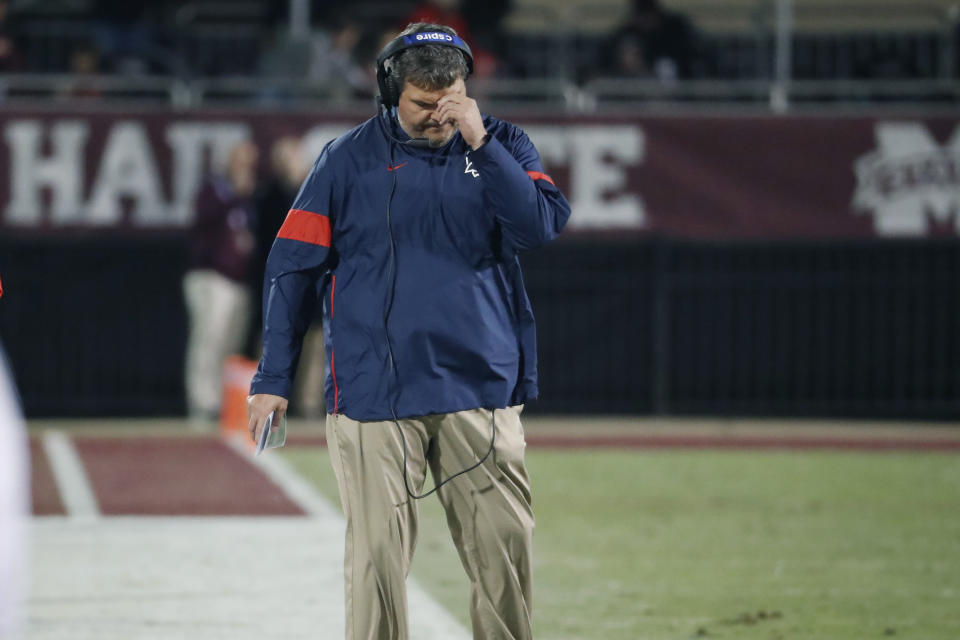 In this Nov. 28, 2019 photograph, Mississippi head coach Matt Luke reacts to a play against Mississippi state during an NCAA college football game in Starkville, Miss. Mississippi has fired Luke, three days after his third non-winning season ended with an excruciating rivalry game loss. Athletic director Keith Carter said Sunday, Dec. 1, 2019 the decision to change coaches was made after evaluating the trajectory of the program and not seeing enough “momentum on the field. (AP Photo/Rogelio V. Solis)