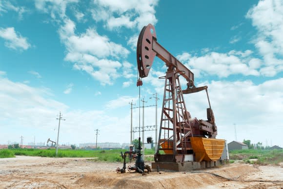 An oil pump with a blue sky in the background.