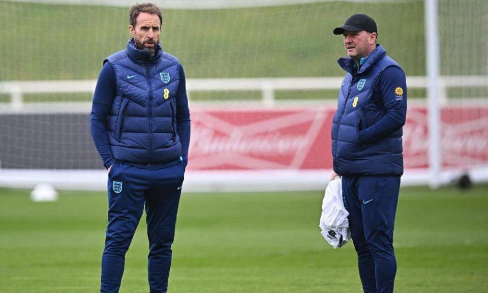 England’s manager Gareth Southgate (left) oversees training