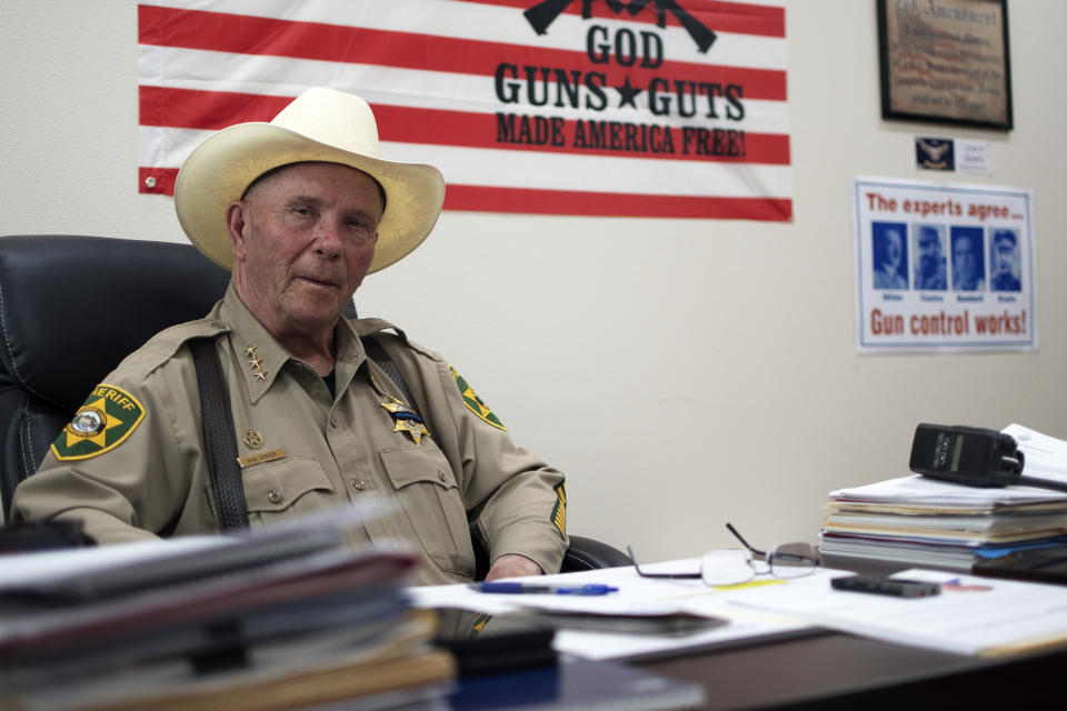 In this photo provided by the Arizona Center for Investigative Reporting, Klickitat County Sheriff Bob Songer talks in his office in Goldendale, Wash., July 5, 2023. Songer is an advisory board member of the Constitutional Sheriffs and Peace Officers Association and has faced harsh criticism for his embrace of the organization's ideology about the extent of the power of the sheriff. (Isaac Stone Simonelli/Arizona Center for Investigative Reporting via AP)