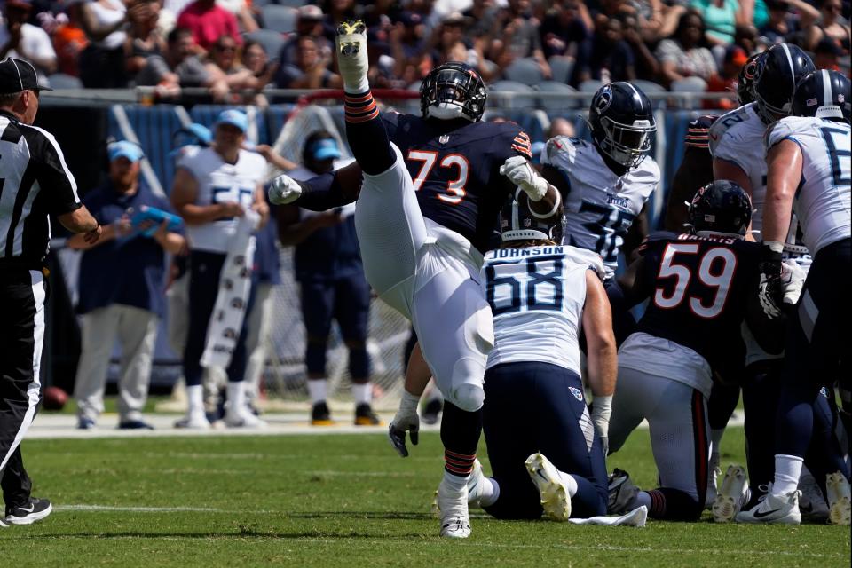 Chicago Bears defensive tackle Travis Bell (73) celebrates his sack against the Tennessee Titans during the second half at Soldier Field.