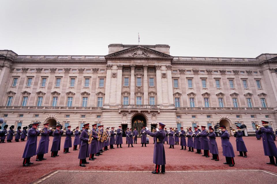 The Band of the Household Cavalry perform on the forecourt of Buckingham Palace in London after playing Happy Birthday before the ceremony for the Changing of the Guard to mark the 74th birthday of King Charles III on November 14, 2022.