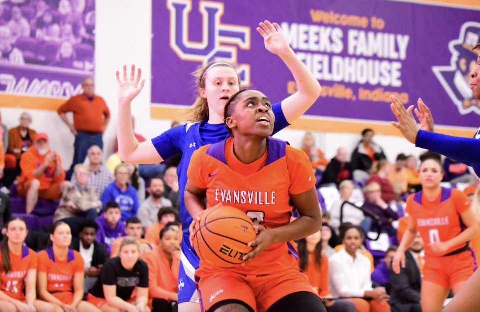 Evansville guard Myia Clark drives to the basket against Indiana State.