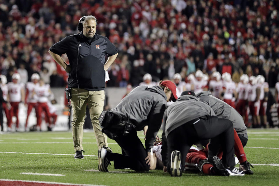 Nebraska head coach Matt Rhule checks on Nick Henrich after an injury during overtime of an NCAA college football game against Wisconsin Saturday, Nov. 18, 2023 in Madison, Wis. (AP Photo/Aaron Gash)