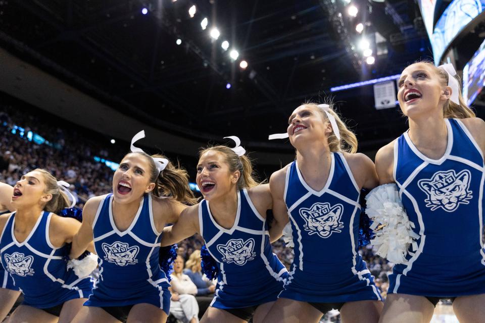 BYU cheerleaders sing during their game against Texas in Provo on Saturday, Jan. 27, 2024. BYU won 84-72. | Marielle Scott, Deseret News