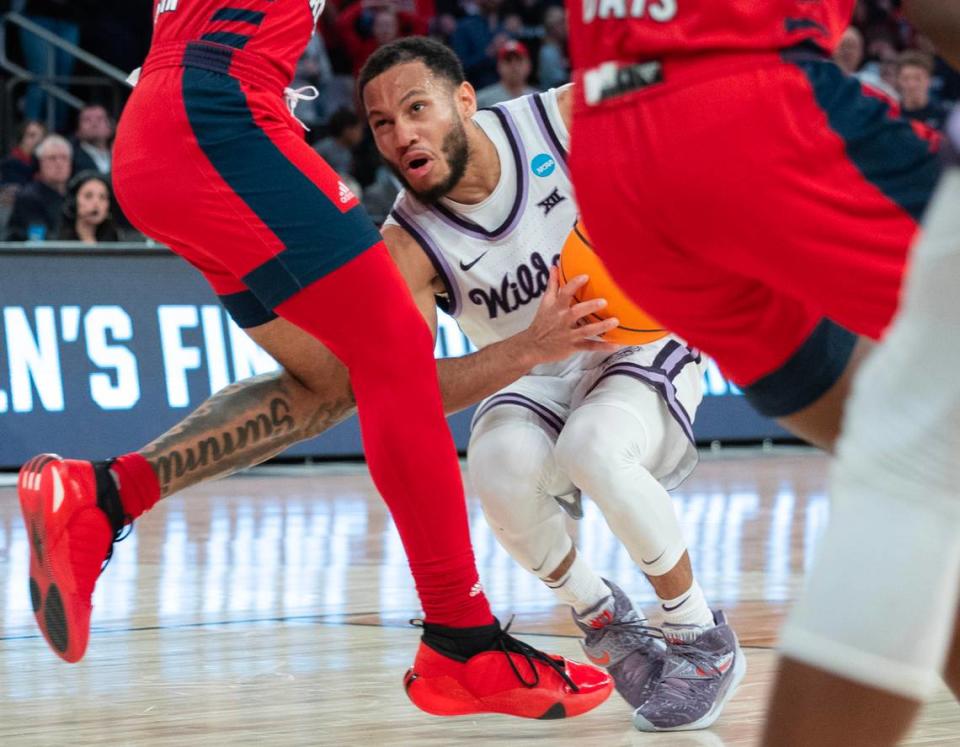 Kansas State’s Markquis Nowell runs into a wall of Florida Atlantic defenders during the second half of their east region final game at Madison Square Garden on Saturday night.