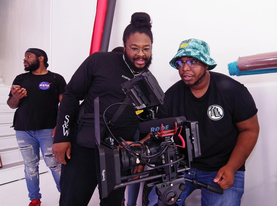 Director Czarr Freeman goes over a shot with camera operator Chris Ruiz during a video shoot at the Garage Media Center at the SoundLab in Brockton during the center's open house on Sunday, Aug. 28, 2022.