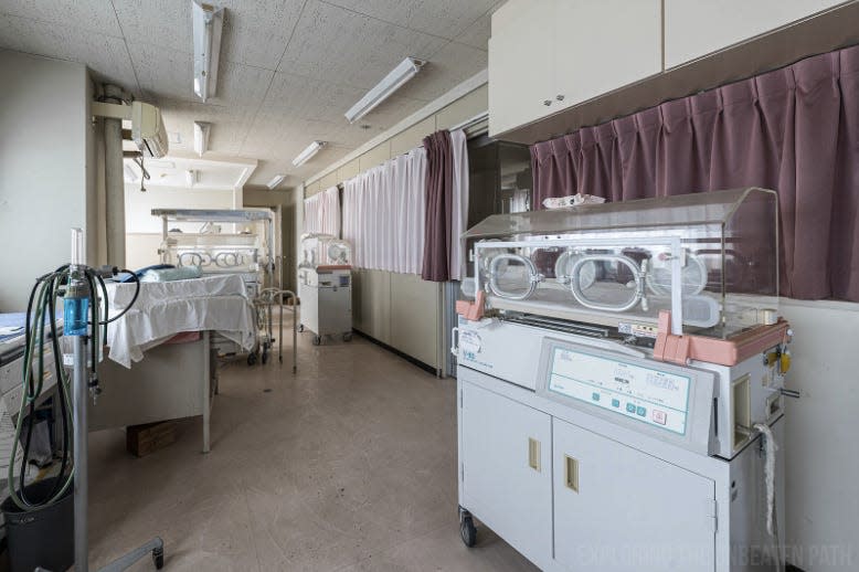 Empty hospital equipment and infant beds in the neonatal intensive care unit of an abandoned hospital in Fukushima.