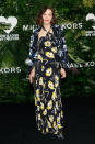 <p>Maggie Gyllenhaal wore a black-and-lemon floral silk-georgette halter gown from the Resort 2018 Michael Kors Collection.</p>