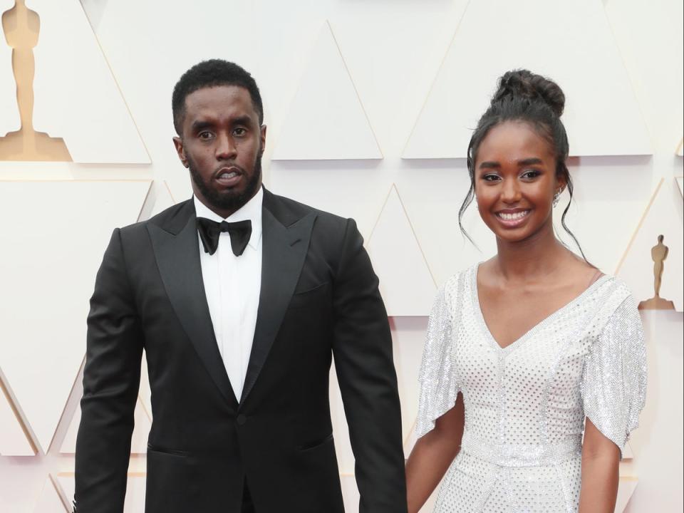 Sean Combs (left) and his daughter Chance at the Oscars in March 2022. Chance Combs, 18, posted photos on Instagram on Sunday showing her holding her diploma while wearing a graduation cap and gown, but her father was nowhere in sight. (David Livingston/Getty Images)