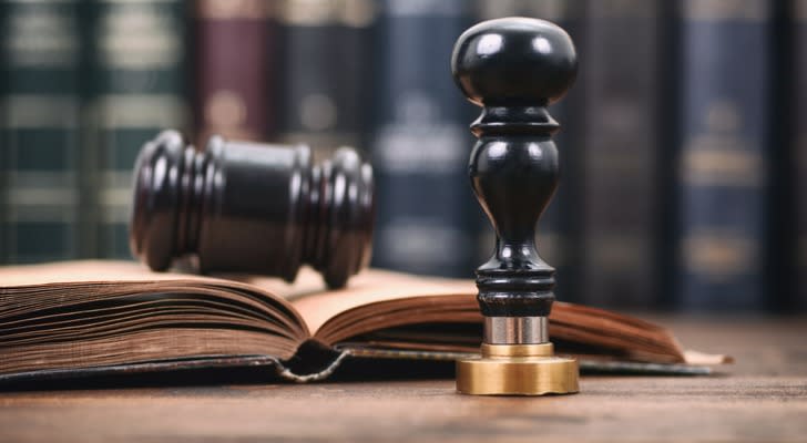 Notary seal and gavel on top of a law book