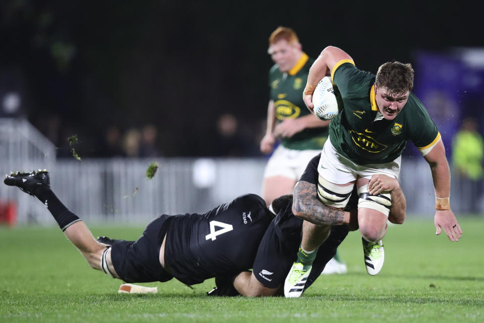 South Africa's Jasper Wiese is tackled by defenders during the Rugby Championship test match between the All Blacks and South Africa at Mt Smart Stadium in Auckland, New Zealand, Saturday, July 15, 2023. ( Aaron Gillions/Photosport via AP)