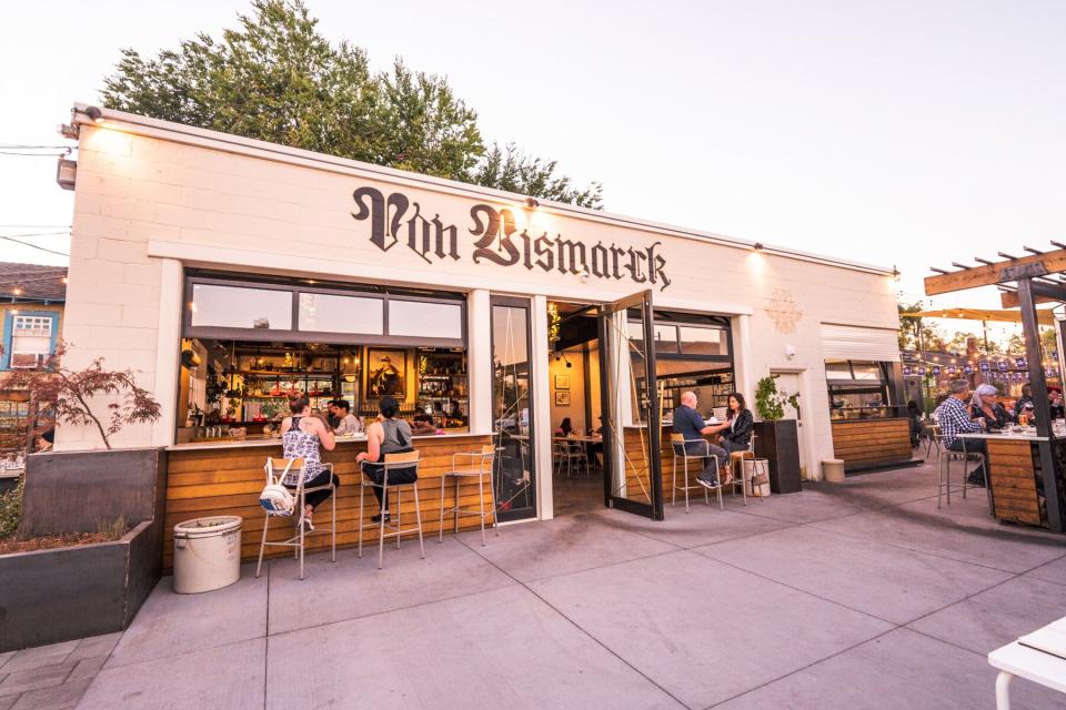 Exterior of people eating at Von Bismarck