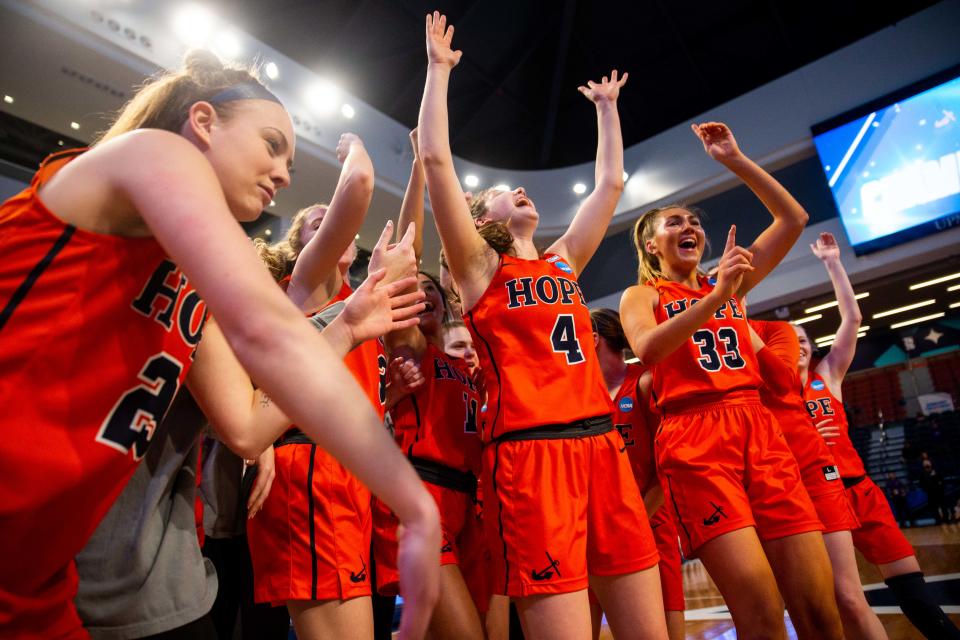 The Hope women's basketball team celebrates their 71-58 win over UW Whitewater in the national championship game Saturday, March 19, 2022, at UPMC Cooper Fieldhouse in Pittsburgh. 