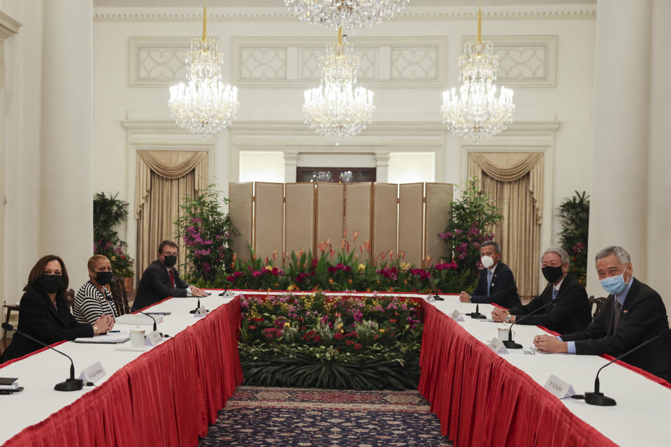 U.S. Vice President Kamala Harris, left, meets Singapore's Prime Minister Lee Hsien Loong, right, in a bilateral meeting at the Istana in Singapore Monday, Aug. 23, 2021. (Evelyn Hockstein/Pool Photo via AP)