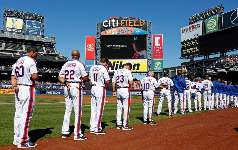 <p>Members of the New York Mets stand for a moment of silence in honor of for Jose Fernandez of the Miami Marlins prior to taking on the Philadelphia Phillies at Citi Field on September 25, 2016 in the Flushing neighborhood of the Queens borough of New York City. (Adam Hunger/Getty Images) </p>