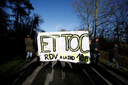 Residents of the zoned ZAD (Deferred Development Zone) react after the French government's official announcement to abandon the Grand Ouest Airport (AGO) project in Notre-Dame-des-Landes, near Nantes, France, January 17, 2018. REUTERS/Stephane Mahe