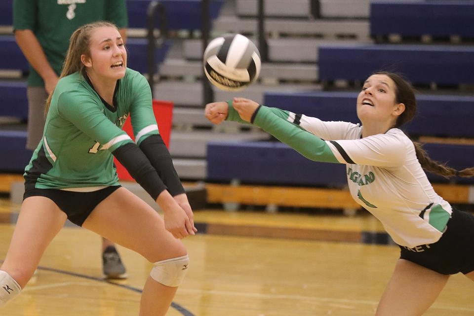 Alayna Tessena, left, and Corrinne Mutch kept Highland rolling with a three-set win over Perry on Sept. 17, 2022.