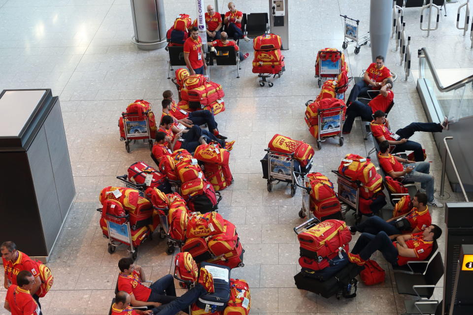 Members of the Spanish Olympic team arrive at Heathrow Airport, in London on Tuesday, July 24, 2012. The opening ceremonies of the Olympic Games are scheduled for Friday, July 27. (AP Photo/Steve Parsons, PA) UNITED KINGDOM OUT; NO SALES; NO ARCHIVE