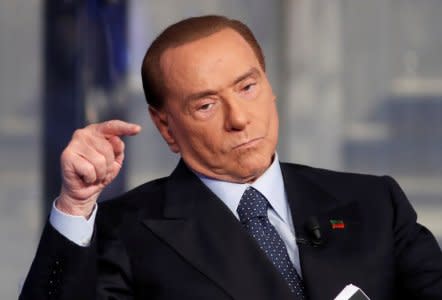 FILE PHOTO: Italy's former Prime Minister Silvio Berlusconi gestures during the taping of the television talk show