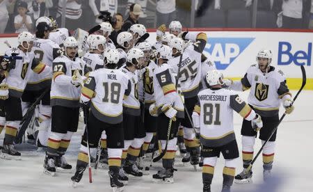 May 20, 2018; Winnipeg, Manitoba, CAN; Vegas Golden Knights players celebrate after defeating the Winnipeg Jets in game five of the Western Conference Final of the 2018 Stanley Cup Playoffs at Bell MTS Place. Mandatory Credit: James Carey Lauder-USA TODAY Sports