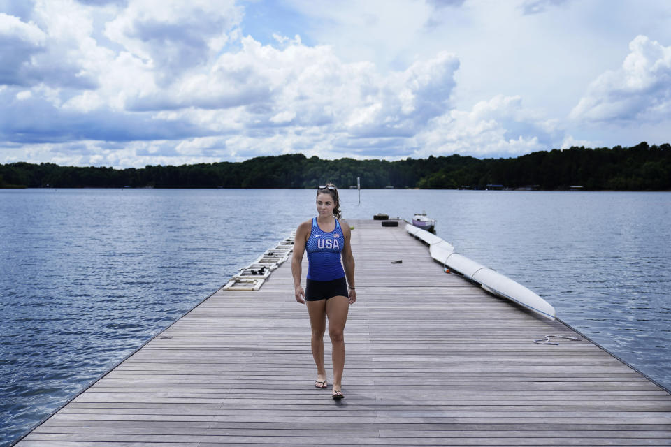 Canoe sprint world champion Nevin Harrison, 19, of Seattle, walks off the deck before she trains near Lake Lanier Olympic Park on Thursday, July 1, 2021, in Gainesville, Ga. Harrison won the world championship in the women's sprint canoe 200 meters as a 17-year-old in 2019. Now she'll try to duplicate that at the Olympics in Tokyo where the race will be a new event in a bid for gender equity. (AP Photo/Brynn Anderson)