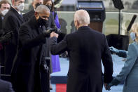 President-elect Joe Biden bumps fists with former President Barack Obama during Biden's inauguration, Wednesday, Jan. 20, 2021, at the U.S. Capitol in Washington./Pool Photo via AP)