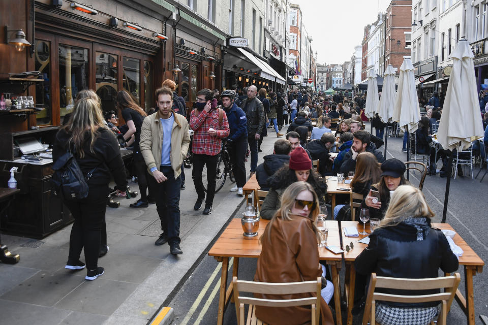 People outside pubs and restaurants in Soho, London, on the day some of England's coronavirus lockdown restrictions were eased on 12 April. Photo: AP Photo/Alberto Pezzali