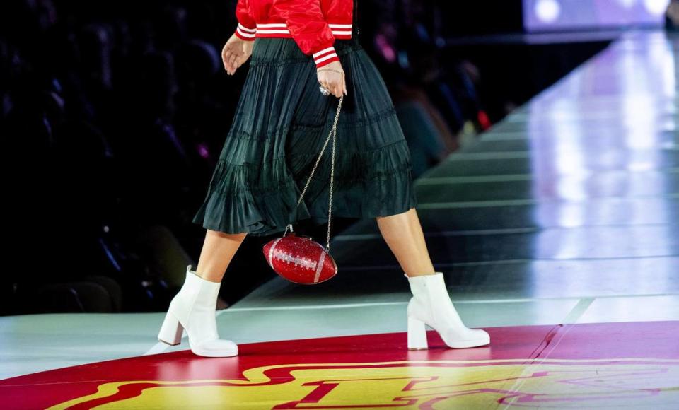 A model carries a crystal football handbag during the 12th annual Chiefs Style Lounge on Tuesday, Oct. 17, 2023, in Kansas City.