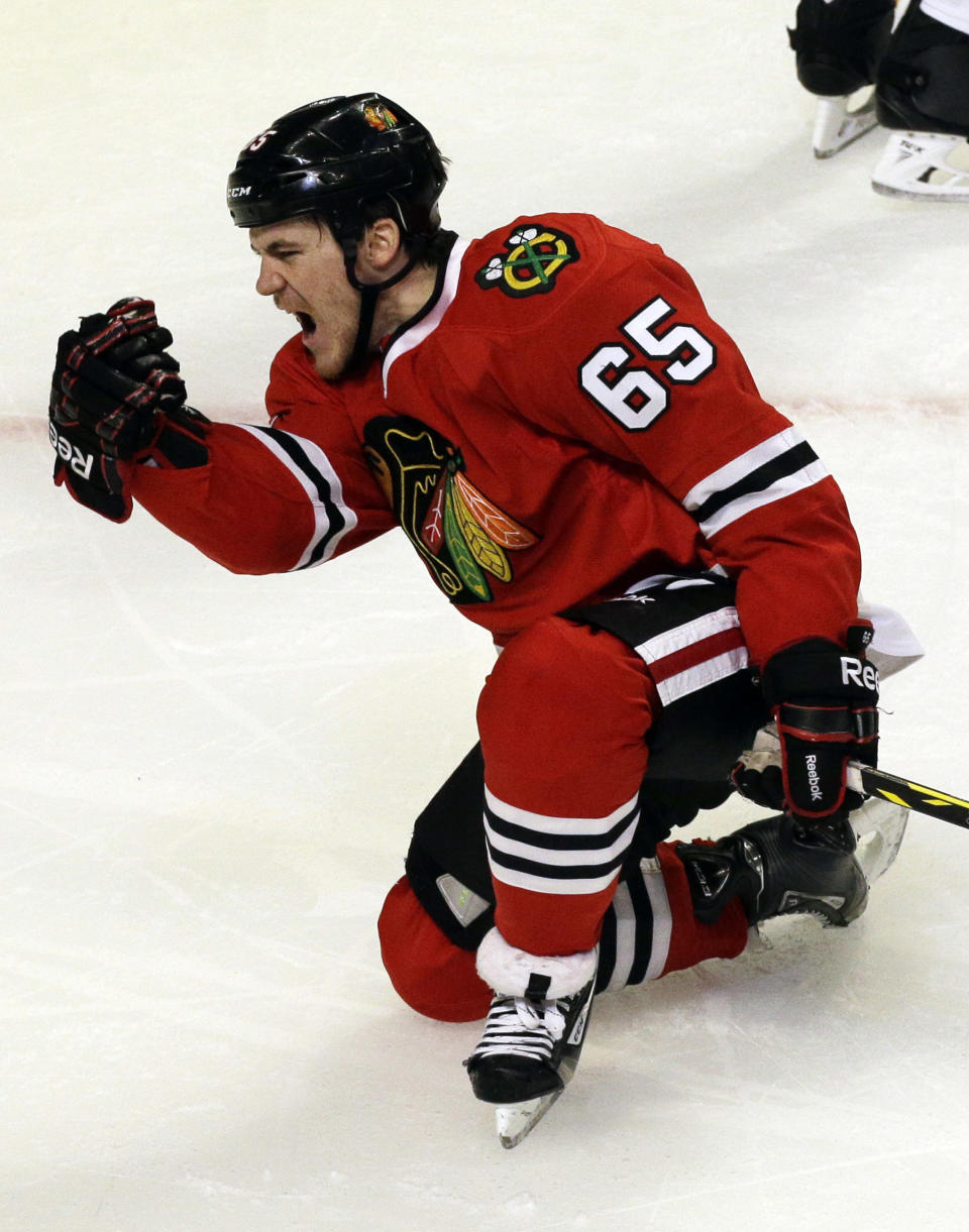 Chicago Blackhawks' Andrew Shaw celebrates after scoring a goal against the St. Louis Blues during the third period in Game 6 of a first-round NHL hockey playoff series in Chicago, Sunday, April 27, 2014. The Blackhawks won 5-1. (AP Photo/Nam Y. Huh)