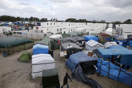 A view shows makeshift shelters, tents and containers where migrants live in what is known as the "Jungle", a sprawling camp in Calais, France, October 12, 2016. REUTERS/Pascal Rossignol