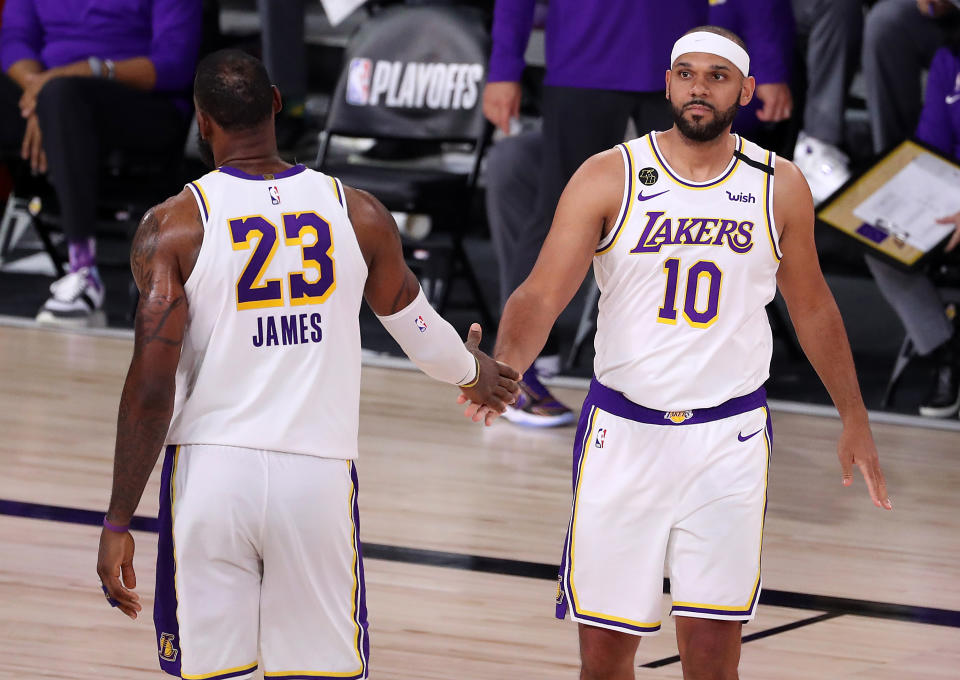 LeBron James #23 of the Los Angeles Lakers high fives Jared Dudley #10 of the Los Angeles Lakers during the fourth quarter in Game Five of the Western Conference Second Round during the 2020 NBA Playoffs at AdventHealth Arena at the ESPN Wide World Of Sports Complex on September 12, 2020 in Lake Buena Vista, Florida. NOTE TO USER: User expressly acknowledges and agrees that, by downloading and or using this photograph, User is consenting to the terms and conditions of the Getty Images License Agreement. (Photo by Michael Reaves/Getty Images)