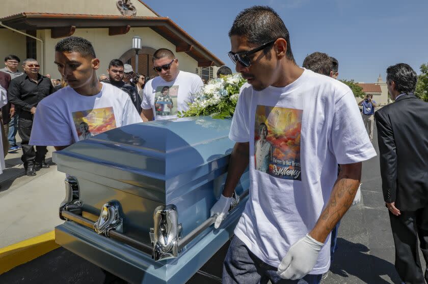 QUARTZ HILLS, CA JULY 20, 2018 -- Victor Avalos,right, father of Anthony Avalos, and other family member bring out the casket after funeral services held at Saint Junipero Serra Parish in Quartz Hills. Anthony Avalos is the Lancaster boy who was allegedly tortured to death by his mother and her boyfriend. (Irfan Khan / Los Angeles Times)