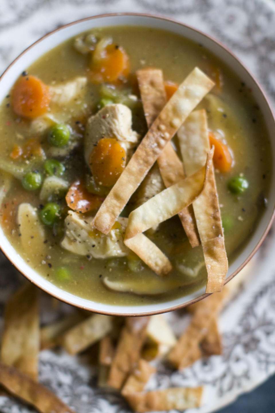 This Dec. 2, 2013 photo shows Chinese chicken and vegetable soup in Concord, N.H. This recipe's fragrant broth is essentially a Chinese version of a Jewish chicken soup. (AP Photo/Matthew Mead)