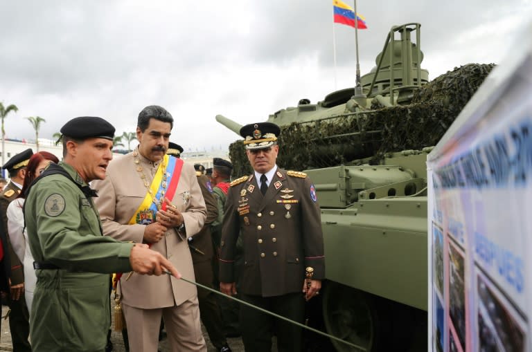 Venezuelan President Nicolas Maduro (C) and Defense Minister Padrino Lopez (R) took part in a parade to commemorate the Battle of Carabobo of June 24, 1821, which marked a decisive step towards the country's independence from colonial rule