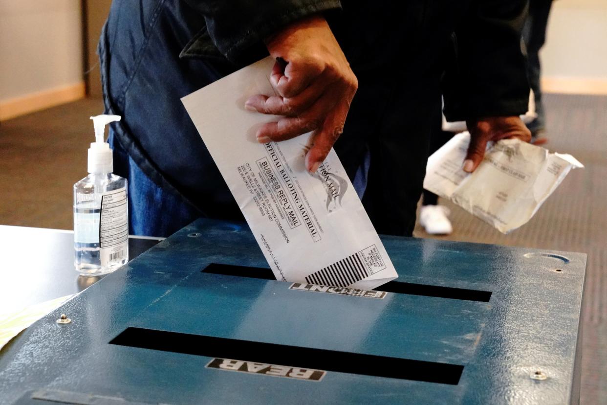 A voter casts a ballot in Milwaukee, Wisconsin on 20 October. (REUTERS)