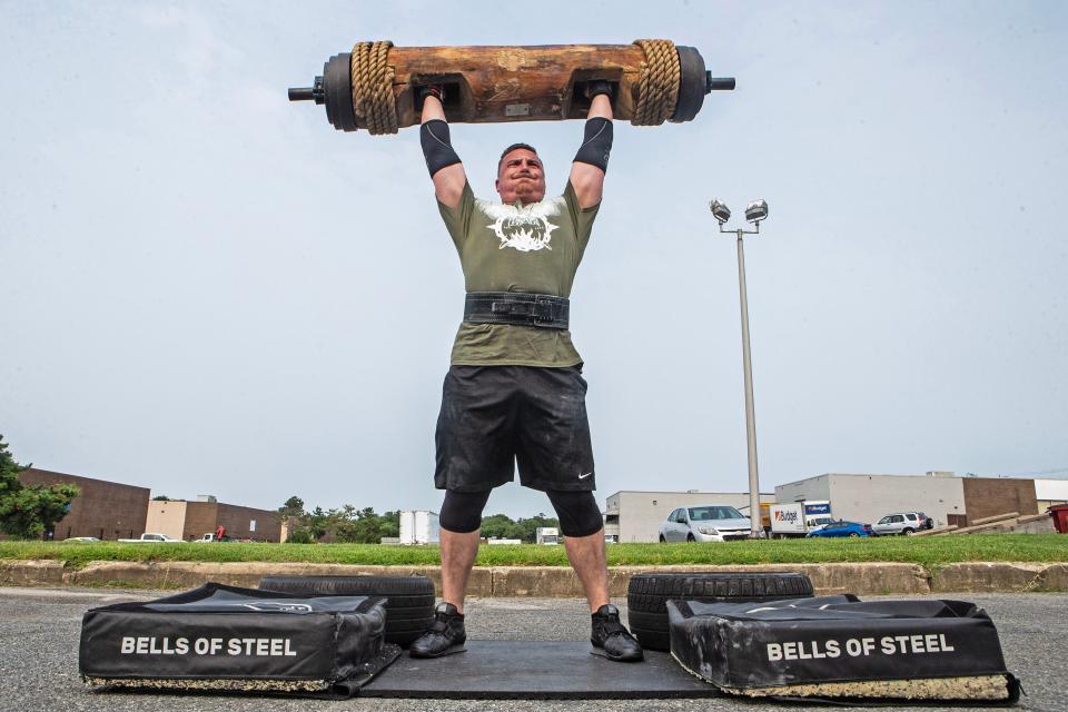 Bradie Crandall performs a 210-pound log press lift at the Training Center near New Castle on Thursday, Aug. 3, 2023. Crandall, a chemical engineering doctoral candidate at the University of Delaware, is among the nation's top powerlifters and a vegan.