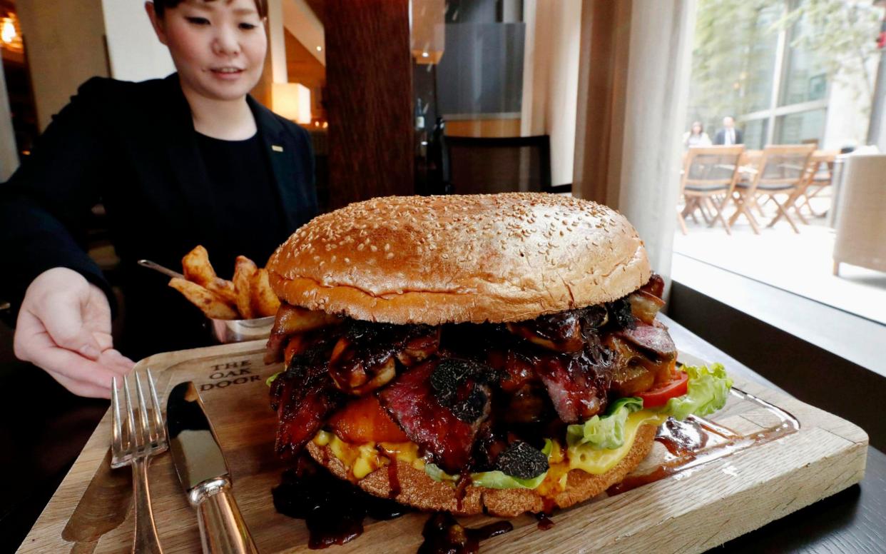 The Golden Giant Burger at the Grand Hyatt in Tokyo serves eight people is made with premium wagyu and contains foie gras and shaved black truffles - Kyodo News