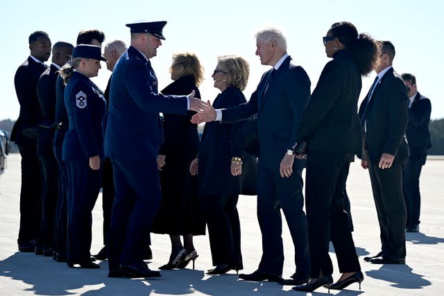 <p>ANDREW CABALLERO-REYNOLDS/AFP via Getty</p> Joe Biden, Jill Biden, Hillary Clinton, Bill Clinton and Michelle Obama are greeted at the Dobbins Air Reserve Base in Marietta, Georgia, on Nov. 28, 2023