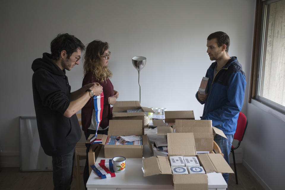 In this photo taken on Dec.16, 2019 members of the Autonomous Union for Interns of the Hospitals of Marseille, southern France, prepare materials in the union office before a march to raise awarness about their ongoing strike. In a hospital in Marseille, student doctors are holding an exceptional, open-ended strike to demand a better future. France’s vaunted public hospital system is increasingly stretched to its limits after years of cost cuts, and the interns at La Timone - one of the country’s biggest hospitals - say their internships are failing to prepare them as medical professionals. Instead, the doctors-in-training are being used to fill the gaps. (AP Photo/Daniel Cole)