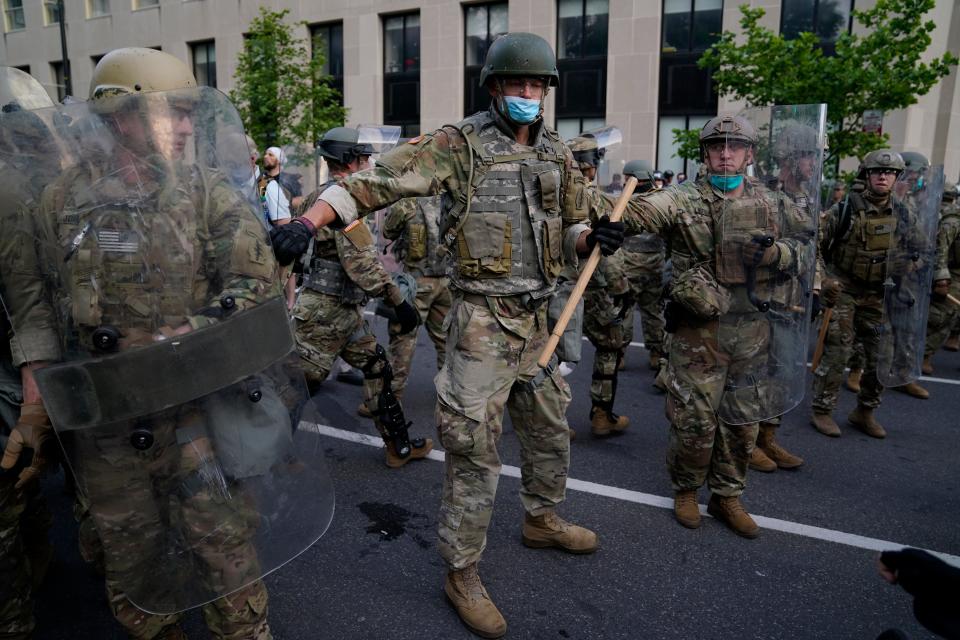 Soldiers with the Utah National Guard stand near the White House as protests continue in the wake of George Floyd's death.