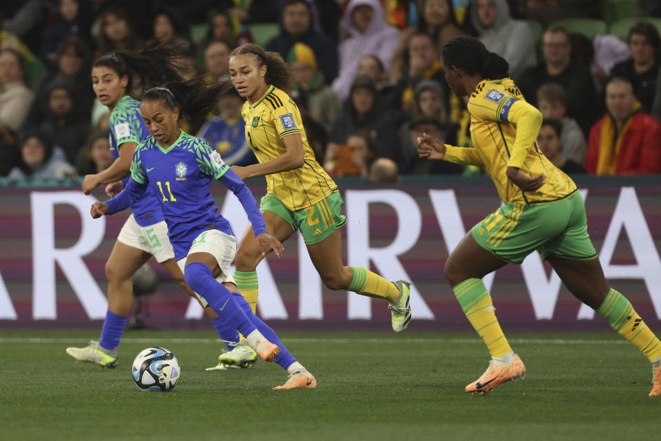 Brazil's Adriana, left, compete for controls the ball with Jamaica's Solai Washington during the Women's World Cup Group F soccer match between Jamaica and Brazil in Melbourne, Australia, Wednesday, Aug. 2, 2023. (AP Photo/Hamish Blair)