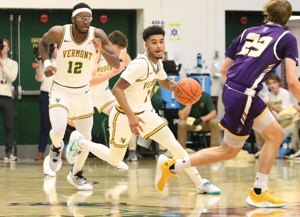 Vermont's Aaron Deloney races up court after a steal in the Catamounts 75-72 win over Albany in the America East quarterfinals on Saturday afternoon at Patrick Gym.