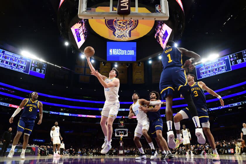 LOS ANGELES, CA - FEBRUARY 23: Austin Reaves #15 of the Los Angeles Lakers shoots the ball during the game against the Golden State Warriors on February 23, 2023 at Crypto.Com Arena in Los Angeles, California. NOTE TO USER: User expressly acknowledges and agrees that, by downloading and/or using this Photograph, user is consenting to the terms and conditions of the Getty Images License Agreement. Mandatory Copyright Notice: Copyright 2023 NBAE (Photo by Adam Pantozzi/NBAE via Getty Images)