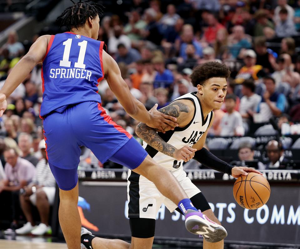 Utah Jazz guard Keyonte George (3) drives around Philadelphia 76ers guard Jaden Springer (11) as the Utah Jazz and Philadelphia 76ers play in Summer League action at the Delta Center in Salt Lake City on Wednesday, July 5, 2023. 76ers won 104-94.